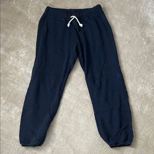 perfectwhitetee Woman’s Navy sweat pants. Size
Large